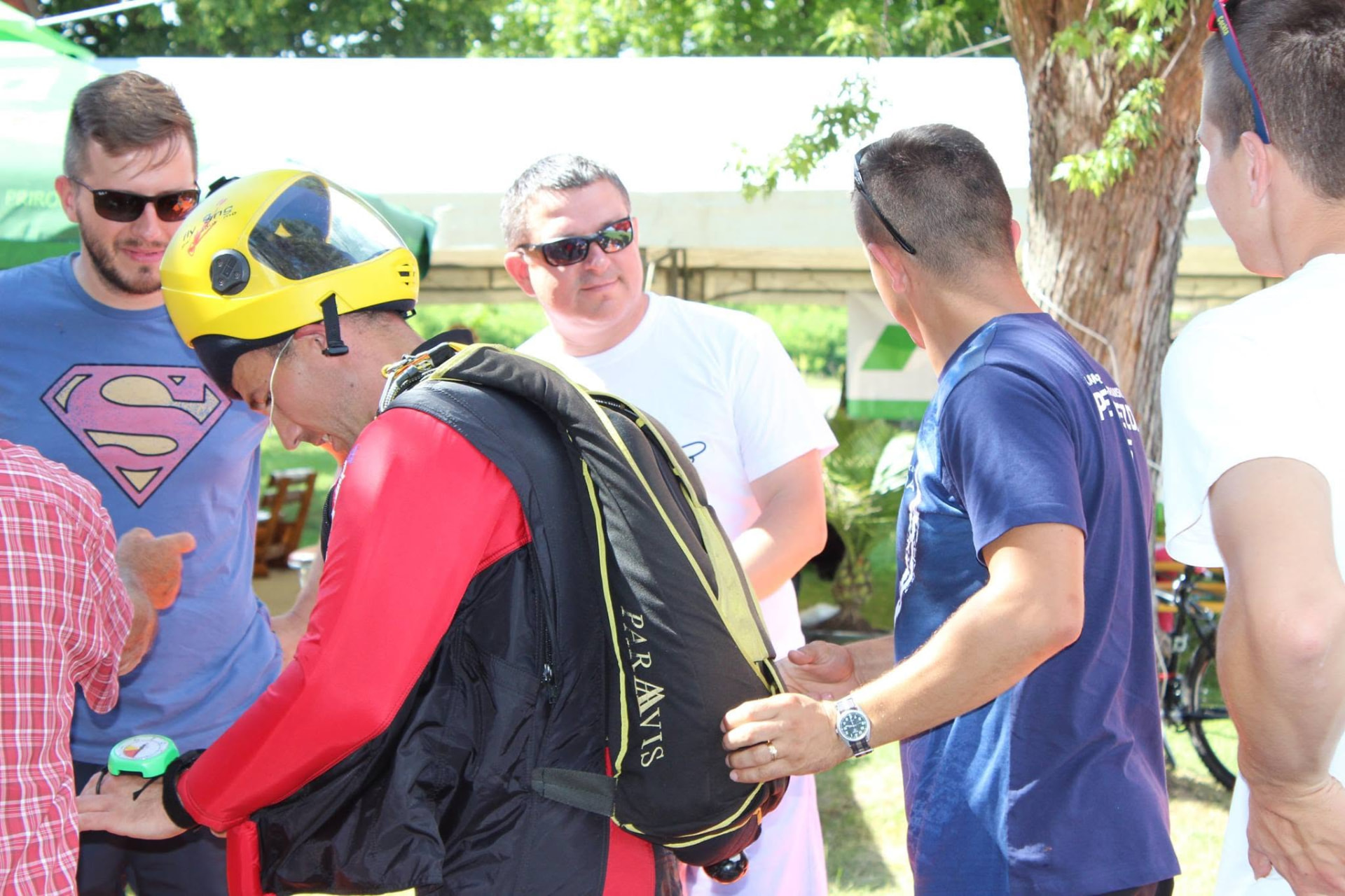 Volunteers checking protective equipment before an activity with participants